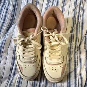 Cream and Pink Reebok sneakers